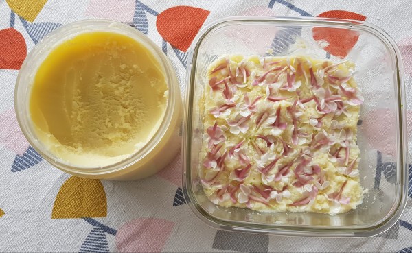 Jasmine flowers laid out in shea butter